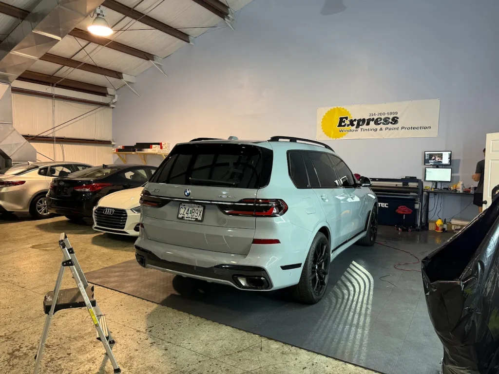 Car receiving premium PPF installation by professionals at Express Window Tinting in Creve Coeur, Missouri.