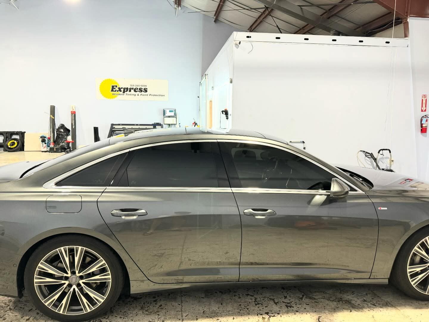 Car with professionally applied window tint and paint protection by Express Window Tinting & Paint Protection, trusted auto protection shop in St. Louis.
